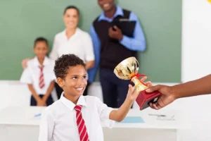 A student receiving a medal at a graduation ceremony