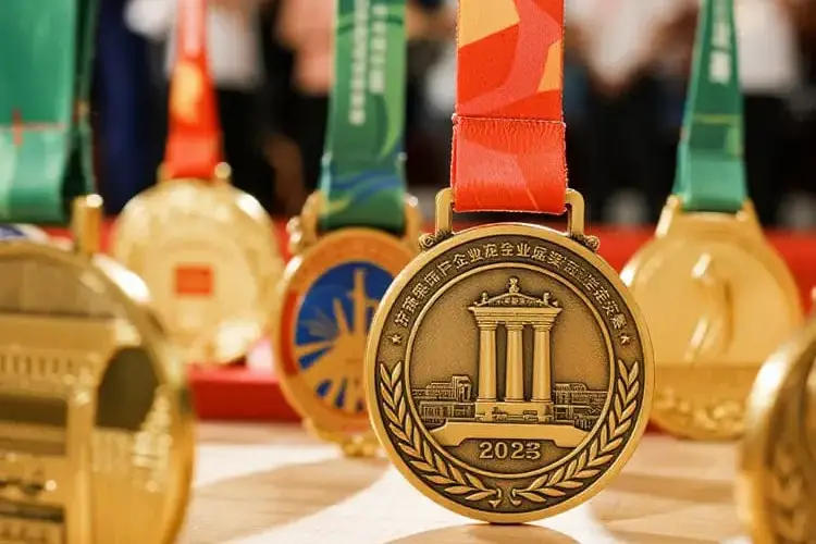 Collection of diverse custom medals for sports, corporate, and academic achievements